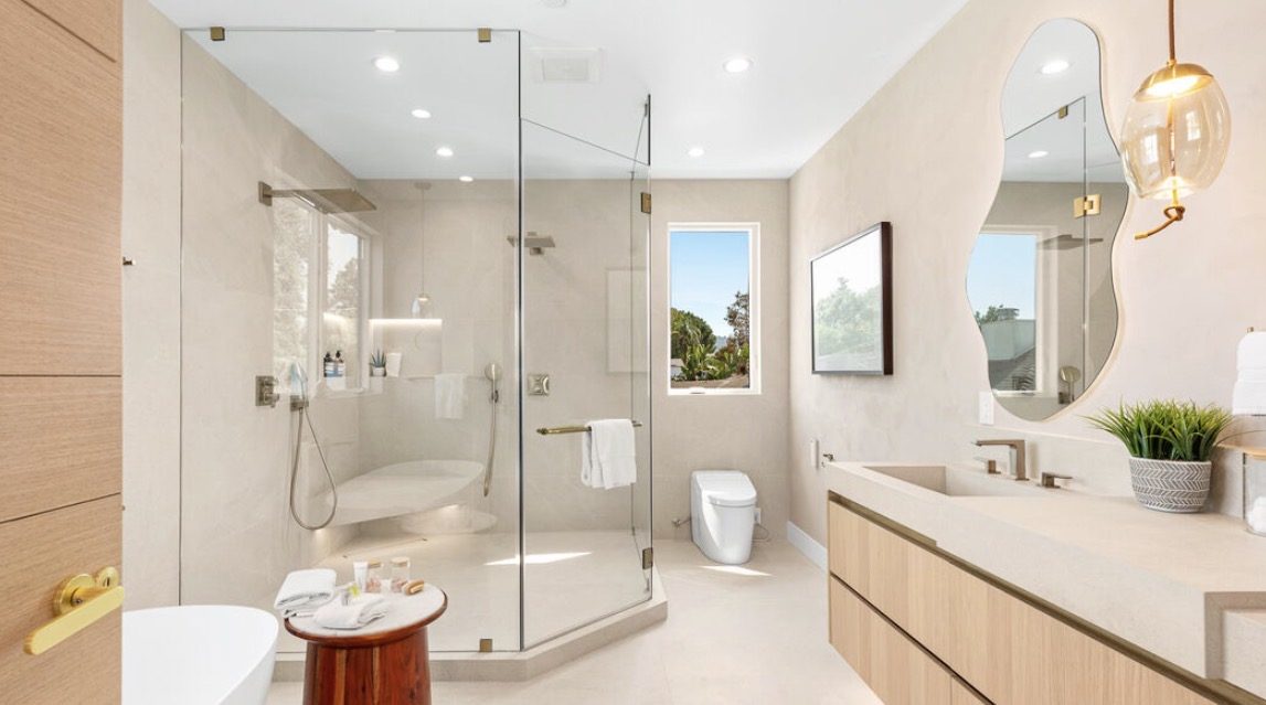 Bathroom with lit mirrors